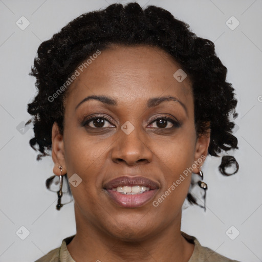 Joyful black adult female with short  brown hair and brown eyes