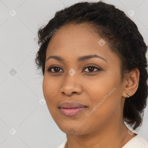 Joyful black young-adult female with medium  black hair and brown eyes