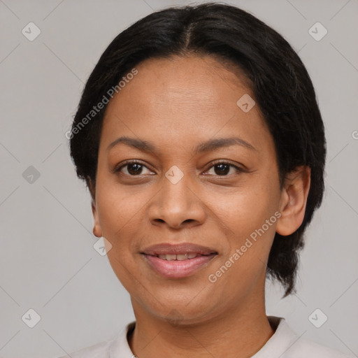 Joyful latino adult female with short  black hair and brown eyes