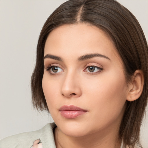 Neutral white young-adult female with medium  brown hair and brown eyes