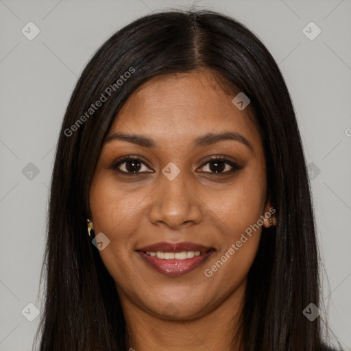 Joyful black young-adult female with long  brown hair and brown eyes