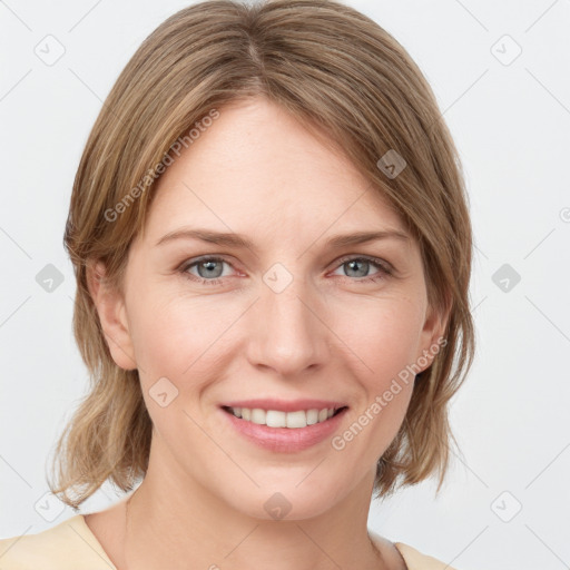 Joyful white young-adult female with medium  brown hair and blue eyes