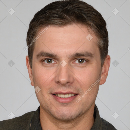 Joyful white adult male with short  brown hair and grey eyes