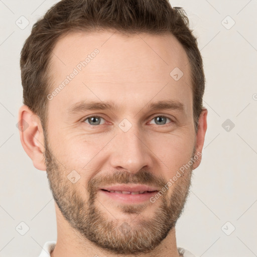 Joyful white adult male with short  brown hair and grey eyes