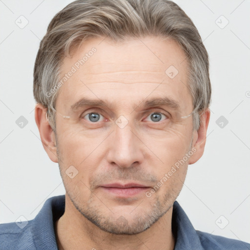 Joyful white adult male with short  brown hair and grey eyes