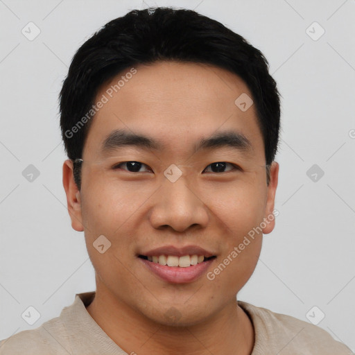 Joyful asian young-adult male with short  black hair and brown eyes