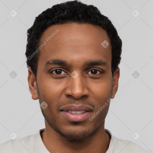 Joyful black young-adult male with short  black hair and brown eyes