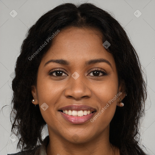 Joyful black young-adult female with long  brown hair and brown eyes