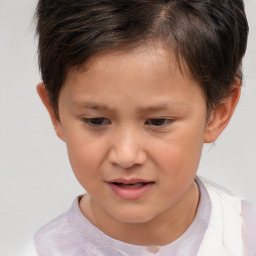 Joyful white child female with short  brown hair and brown eyes