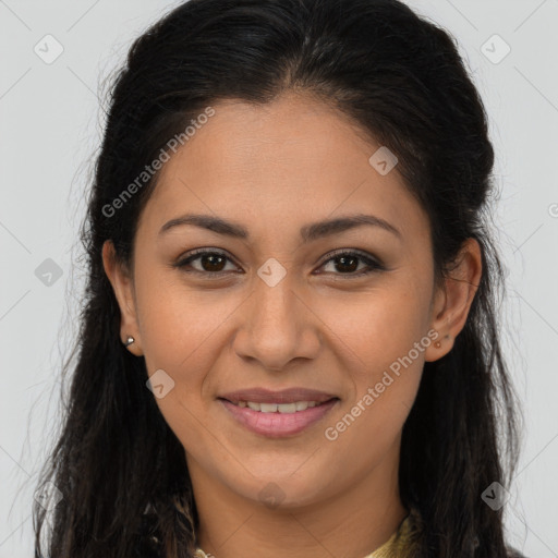 Joyful latino young-adult female with long  brown hair and brown eyes