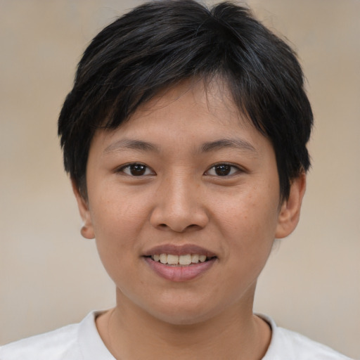 Joyful asian young-adult female with short  brown hair and brown eyes
