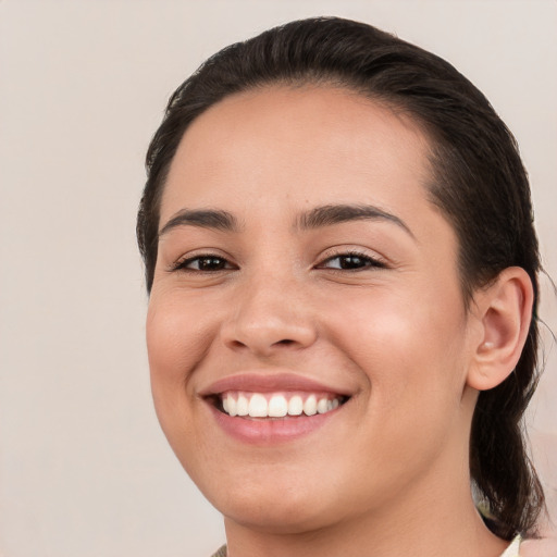 Joyful white young-adult female with medium  brown hair and brown eyes