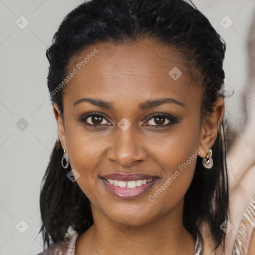 Joyful black young-adult female with long  brown hair and brown eyes