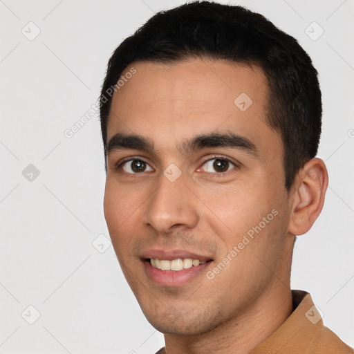 Joyful white young-adult male with short  black hair and brown eyes