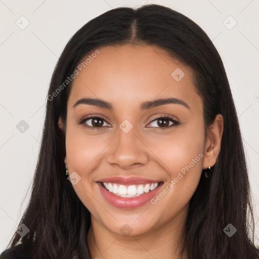 Joyful latino young-adult female with long  black hair and brown eyes