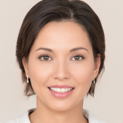 Joyful white young-adult female with medium  brown hair and brown eyes