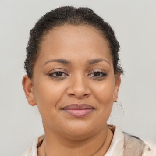 Joyful latino young-adult female with short  brown hair and brown eyes