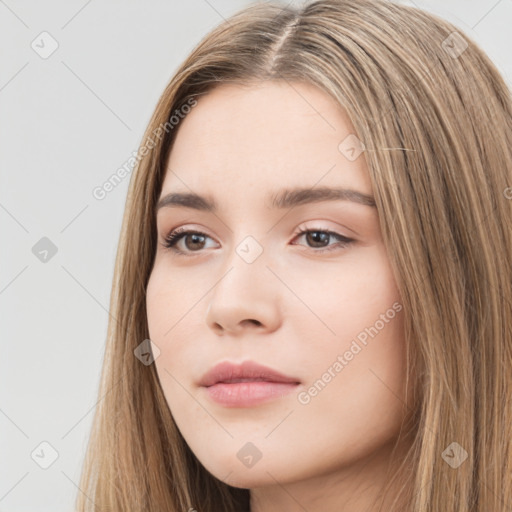 Neutral white young-adult female with long  brown hair and brown eyes