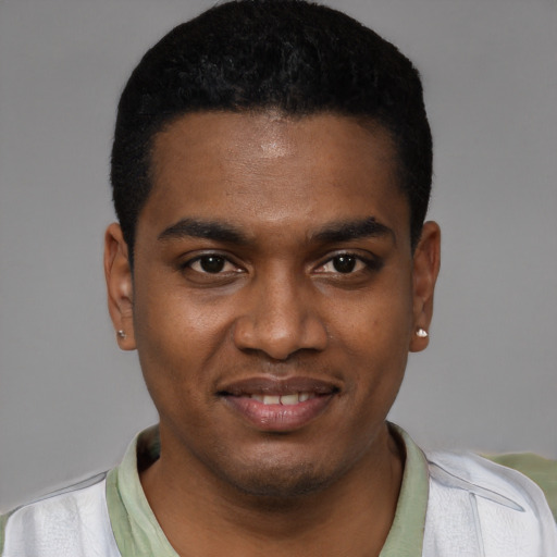 Joyful black young-adult male with short  black hair and brown eyes