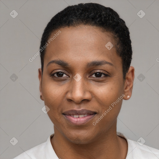 Joyful black young-adult female with short  black hair and brown eyes