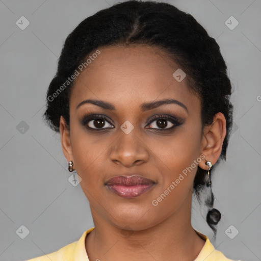 Joyful black young-adult female with short  black hair and brown eyes