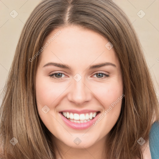 Joyful white young-adult female with long  brown hair and green eyes