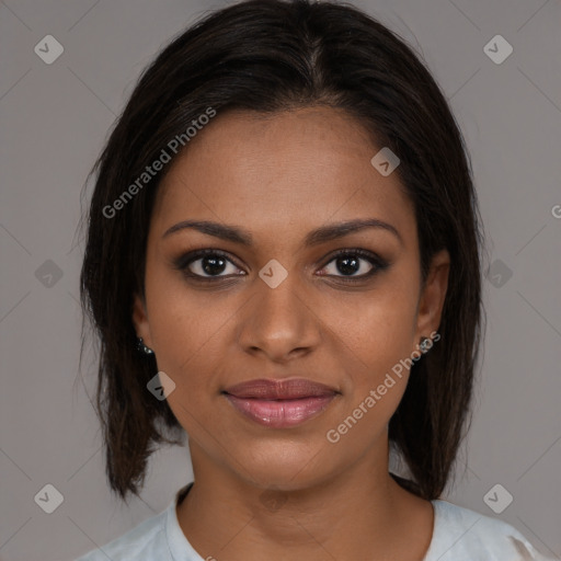 Joyful black young-adult female with medium  brown hair and brown eyes