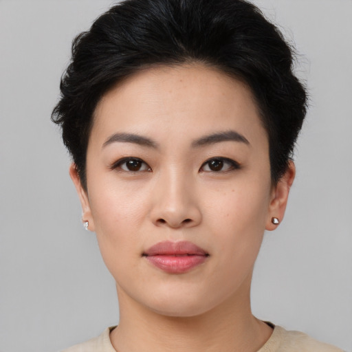 Joyful asian young-adult female with short  black hair and brown eyes