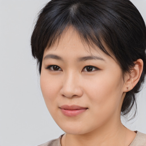 Neutral asian young-adult female with medium  brown hair and brown eyes