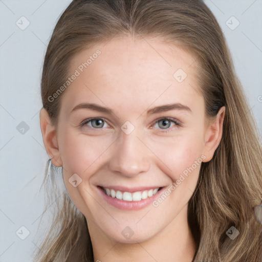 Joyful white young-adult female with long  brown hair and blue eyes