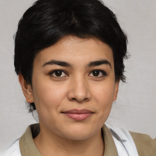 Joyful asian young-adult female with medium  brown hair and brown eyes
