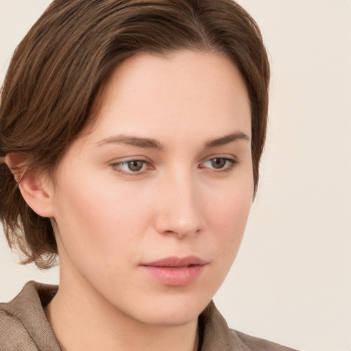 Neutral white young-adult female with long  brown hair and grey eyes