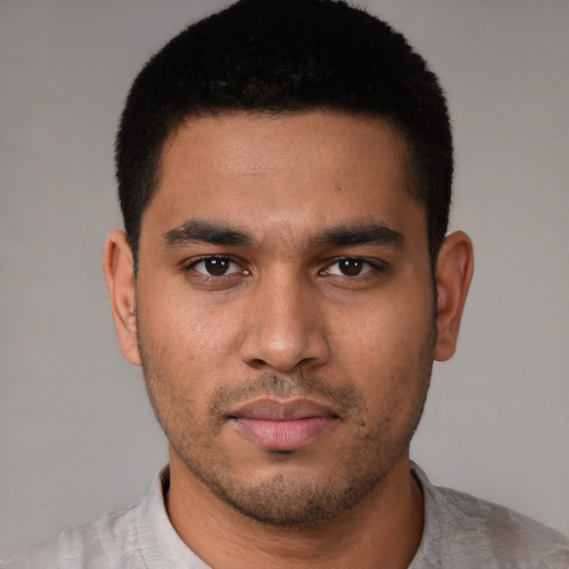 Neutral latino young-adult male with short  black hair and brown eyes