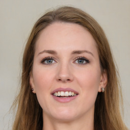 Joyful white young-adult female with long  brown hair and green eyes