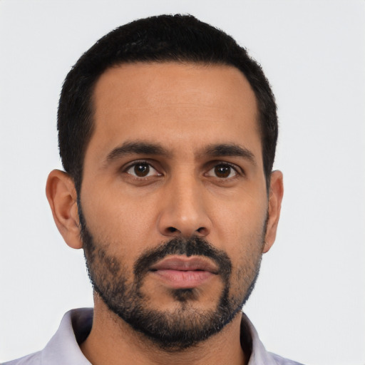 Neutral latino young-adult male with short  black hair and brown eyes