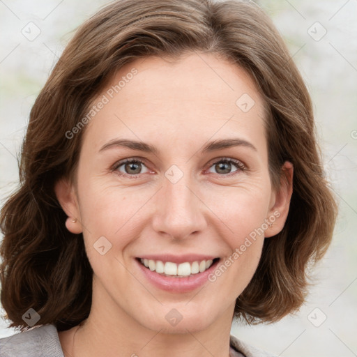 Joyful white young-adult female with medium  brown hair and green eyes