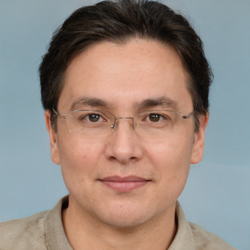 Joyful white adult male with short  brown hair and brown eyes