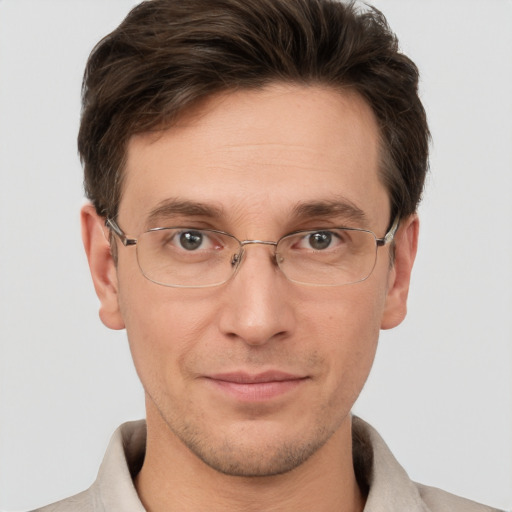 Joyful white adult male with short  brown hair and brown eyes