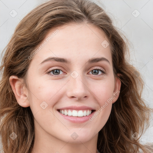 Joyful white young-adult female with long  brown hair and green eyes