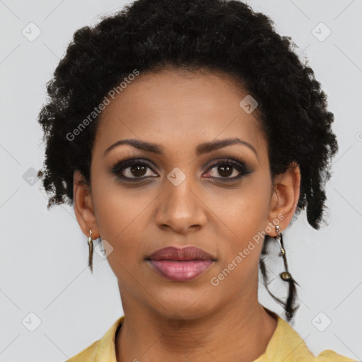 Joyful black young-adult female with long  brown hair and brown eyes