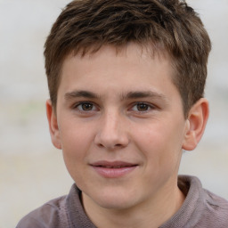 Joyful white child male with short  brown hair and brown eyes