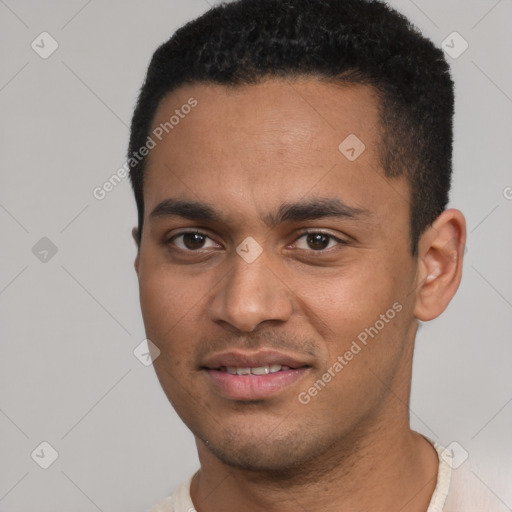 Joyful white young-adult male with short  black hair and brown eyes