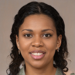 Joyful black young-adult female with medium  brown hair and brown eyes