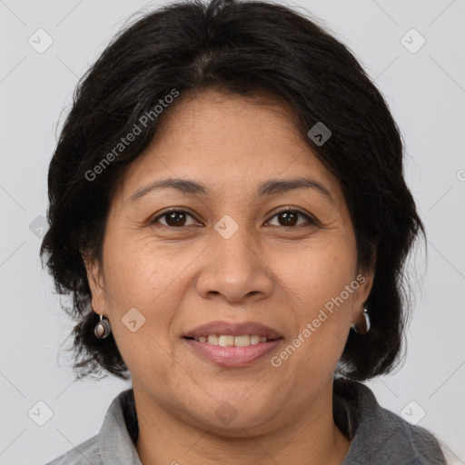 Joyful white adult female with medium  brown hair and brown eyes