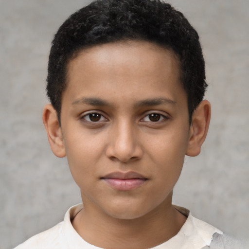 Joyful latino child male with short  brown hair and brown eyes