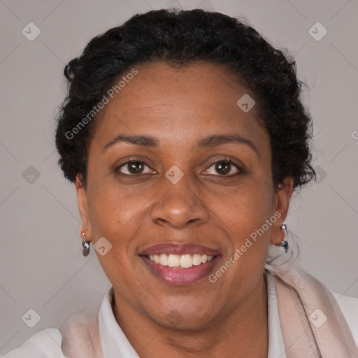 Joyful black adult female with short  brown hair and brown eyes