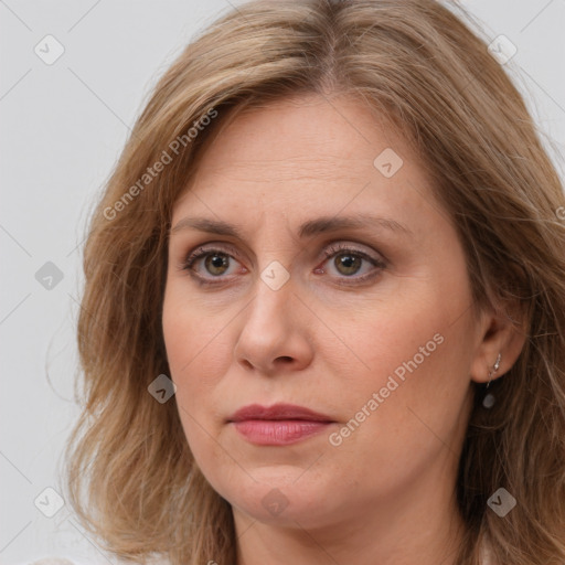 Joyful white adult female with long  brown hair and brown eyes