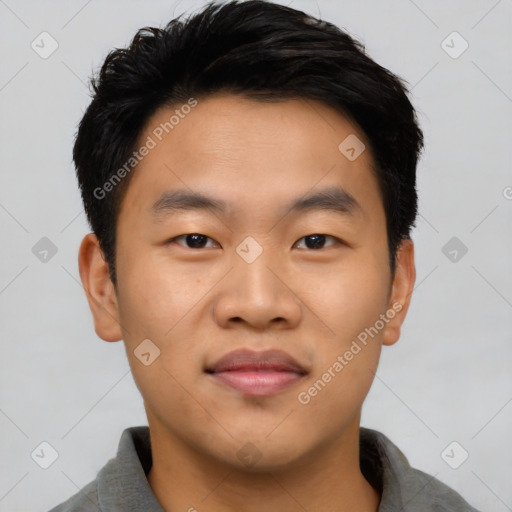 Joyful asian young-adult male with short  black hair and brown eyes