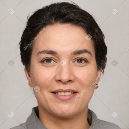 Joyful white adult female with short  brown hair and brown eyes