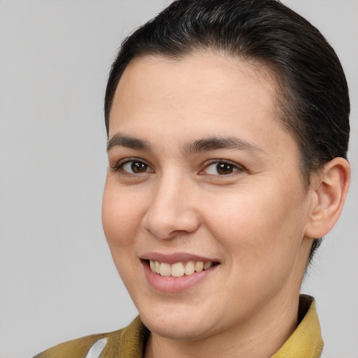 Joyful white young-adult female with short  brown hair and brown eyes